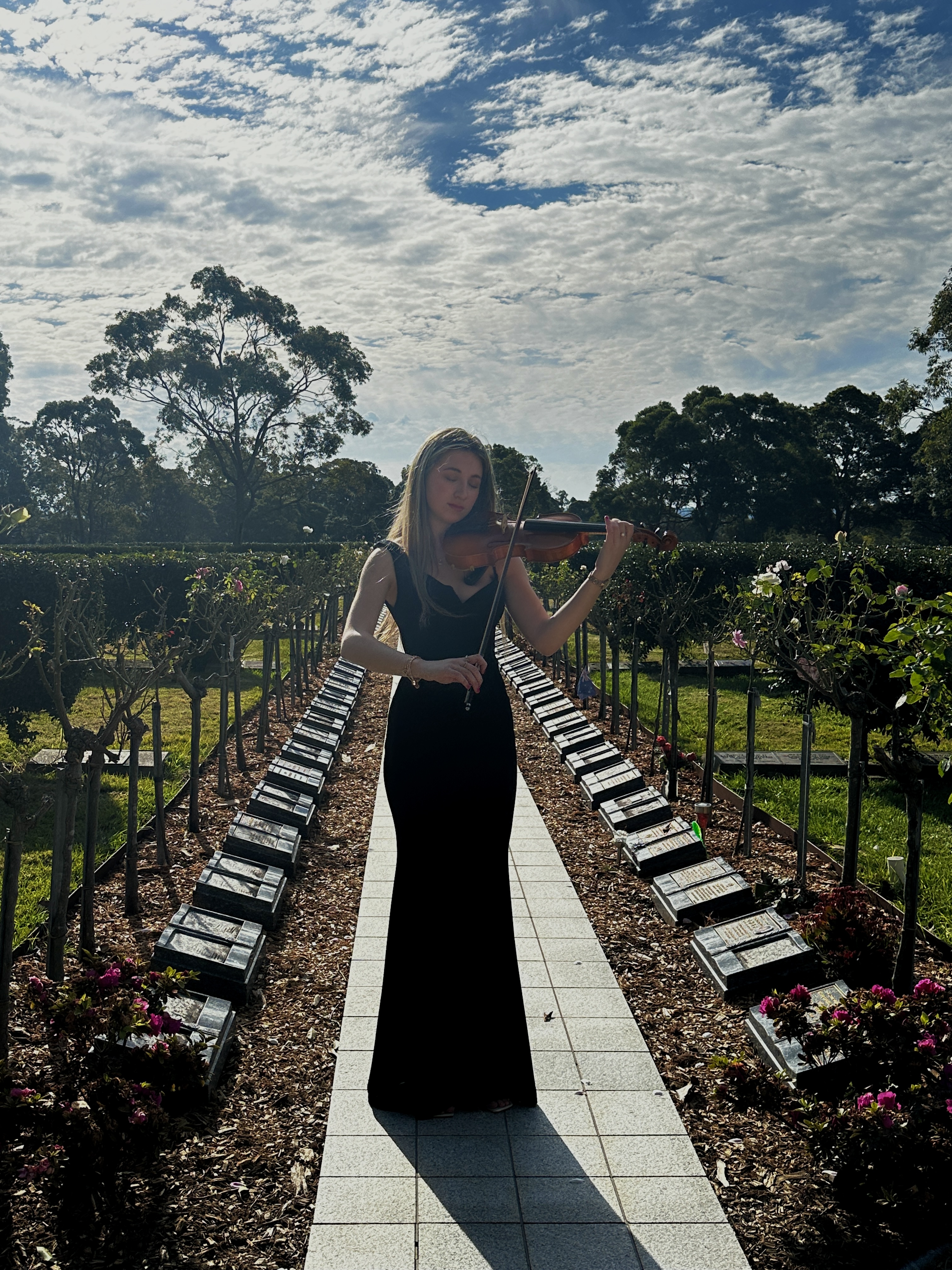Tali playing violin at funeral service